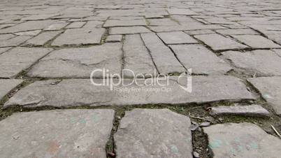 Dolly: Ancient cobblestone pavement in old town