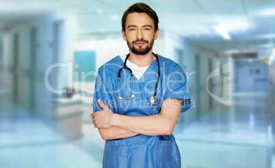 Confident young doctor in a hospital foyer