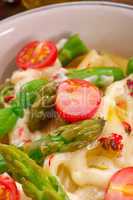 noodles with asparagus in cream-cheese sauce