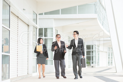 asian business team discussing