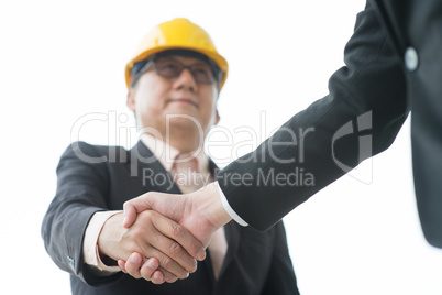 senior male architect hand shaking