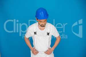 Workman in a blue hardhat