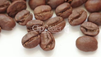 coffee beans flow over white background fill frame