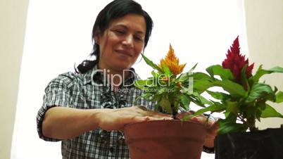 female gardener with green thumbs up