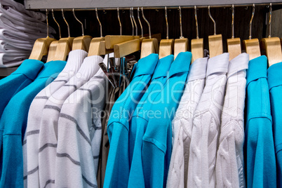 clothing on hangers in shop
