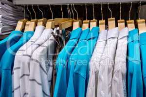 clothing on hangers in shop