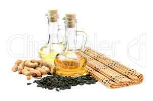 Sunflower seeds, peanuts and bottle of oil