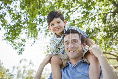 Father and Son Playing Piggyback in the Park