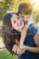 Attractive Mixed Race Mother and Son Hug in Park