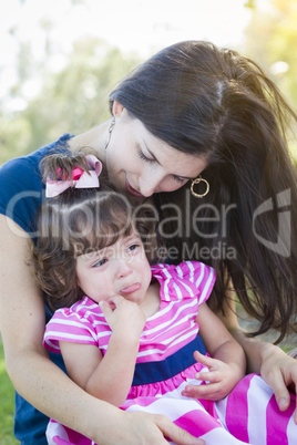 Loving Mother Consoles Crying Baby Daughter