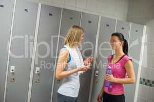 fit women talking in locker room