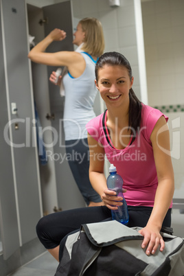 happy woman at gym's locker room