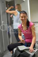 happy woman at gym's locker room