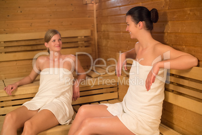 two women talking in the sauna