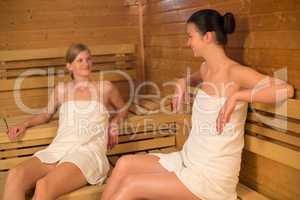 two women talking in the sauna