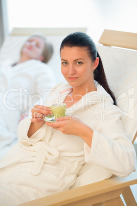 woman enjoy coffee in beauty spa