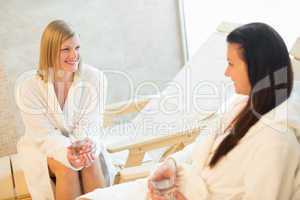 woman talking with friend at beauty spa