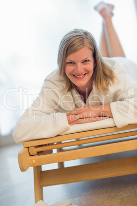 woman lying on bed at spa