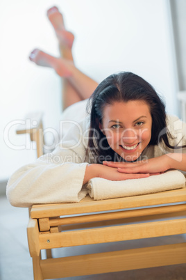 woman relaxing on bed at spa