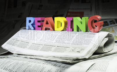 Word reading on newspaper