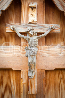 Wood rustic sculpture of Jesus crucified