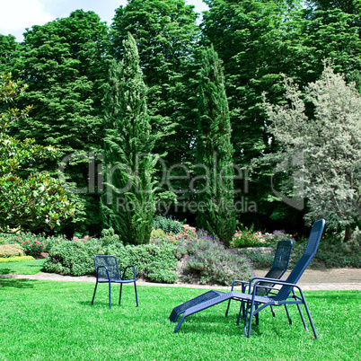 Chaise lounge on the green grass