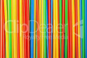 background of colored plastic drinking straws
