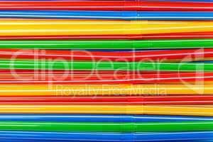 background of colored plastic drinking straws