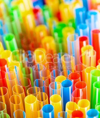 colored plastic drinking straws closeup