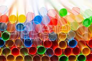 colored plastic drinking straws closeup