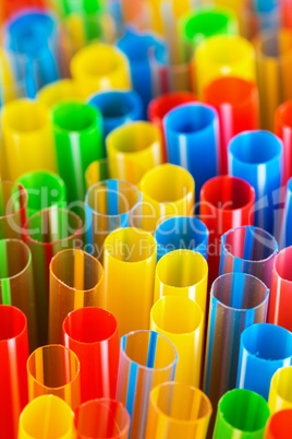 colored plastic drinking straws closeup