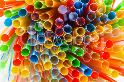 colored plastic drinking straws closeup