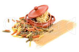 different types of pasta and a clay pot