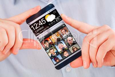 Smartphone with transparent screen in human hands.