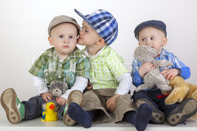 boy kissing his brother