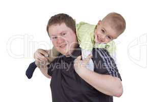 father carrying his child on his shoulders