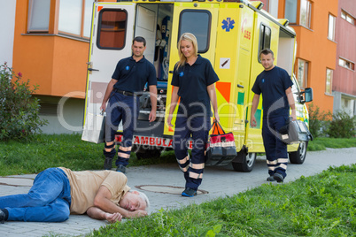 Paramedics arriving to unconscious man