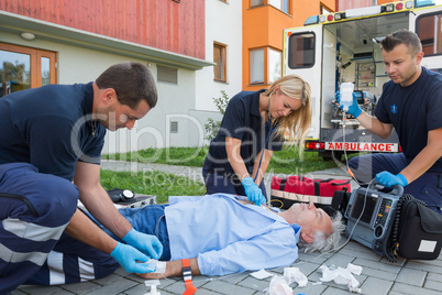 Paramedics giving firstaid to unconscious patient