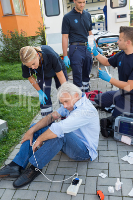 Emergency team giving help to injured man