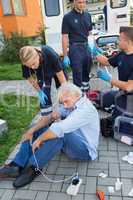 Emergency team giving help to injured man