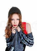 girl in sweater and hat.