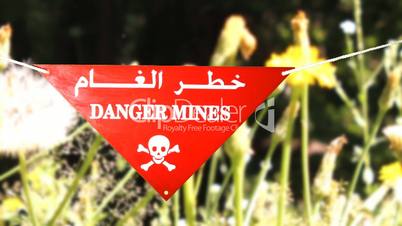 warning sign before a mine field