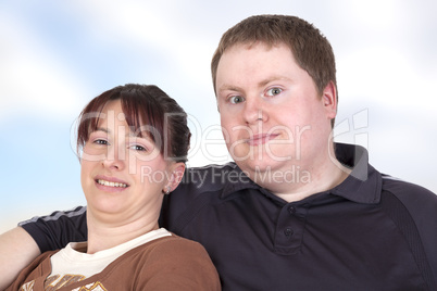 man and woman sitting together on the sofa