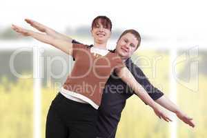 man and woman stretching her arms out with joy