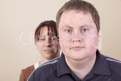 woman with worried look behind man