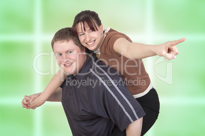 man carrying woman piggyback