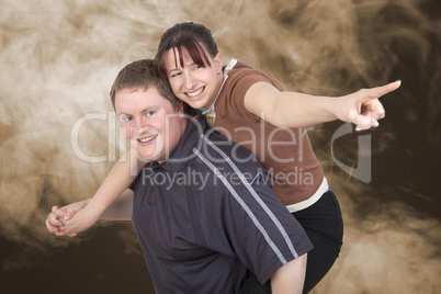 man carrying woman piggyback