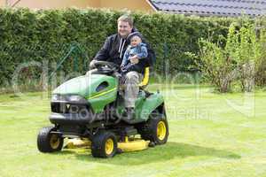 man and child in the garden tractor