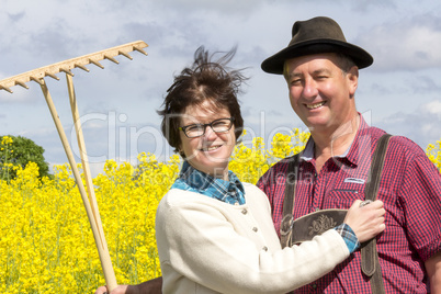 farmer with his wife before the rape field