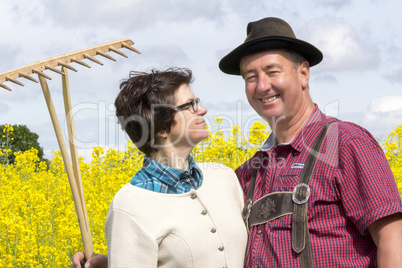 farmer with his wife before the rape field